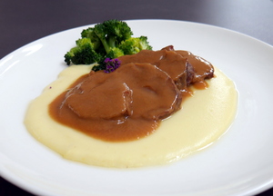 Veal cheeks stew  with mashed potatoes and broccoli 