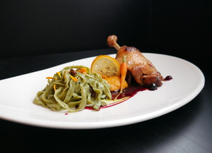 Duck thigh confit with fresh pasta and mashed pumpkin