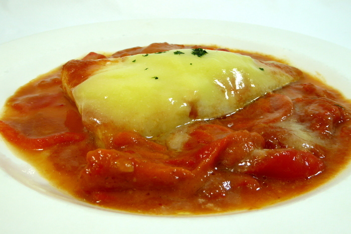 Pollock confit with tomato sauce and green peppers