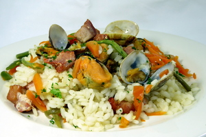 Rice and marinated pork loin, clams and mussels