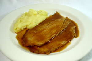 Roasted pork ham with Oporto gravy and mashed potatoes