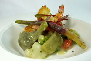 Artichokes and prawns warm salad with a mix of vegetables