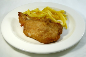 Breaded pan fried pork chop with potatoes