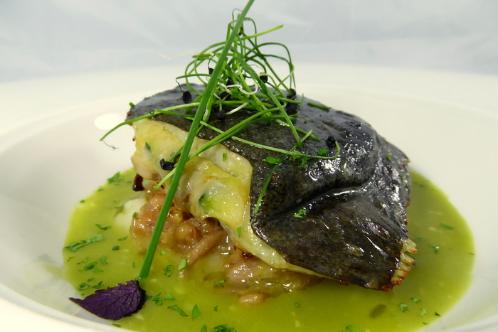 Turbot stuffed with vegetables and served with clam sauce