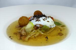 Poached truffled eggs in homemade pasta with foie gras croquettes
