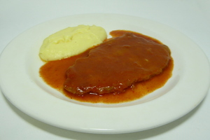 Simmered and buttered veal with biscayne sauce and mashed potatoes
