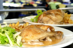 Roast chicken with french fries and salad