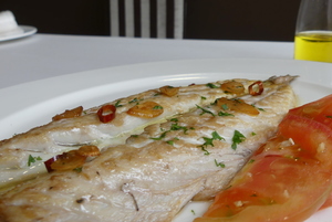 Grilled mackerel with tomato and garlic salad