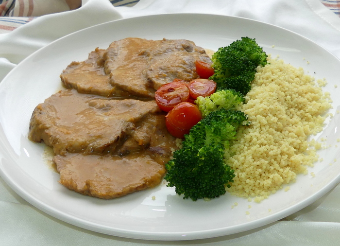 Braised pork loin with mixed vegetables and couscous