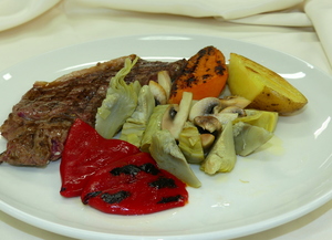 Grilled rib eye with artichokes, mushrooms, peppers, baked potato and sweet potato
