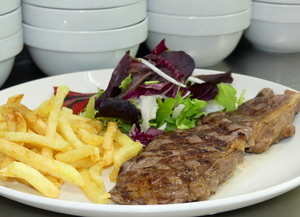 Grilled rib eye with salad and French fries