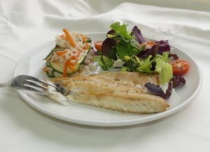 Sea bass with salad and courgette filled with rice and vegetables