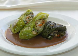 Vegetables and rice stuffed cabbage wraps with kidney beans cream