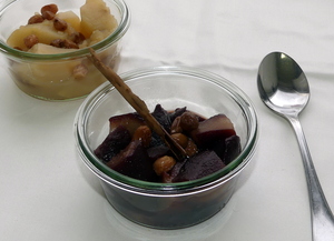 Apple and pear compote with red wine topped with raisins